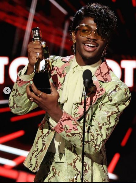 Lil Nas X Instyle with His New Curly Bangs and Gucci Suit in the Billboard Music Awards