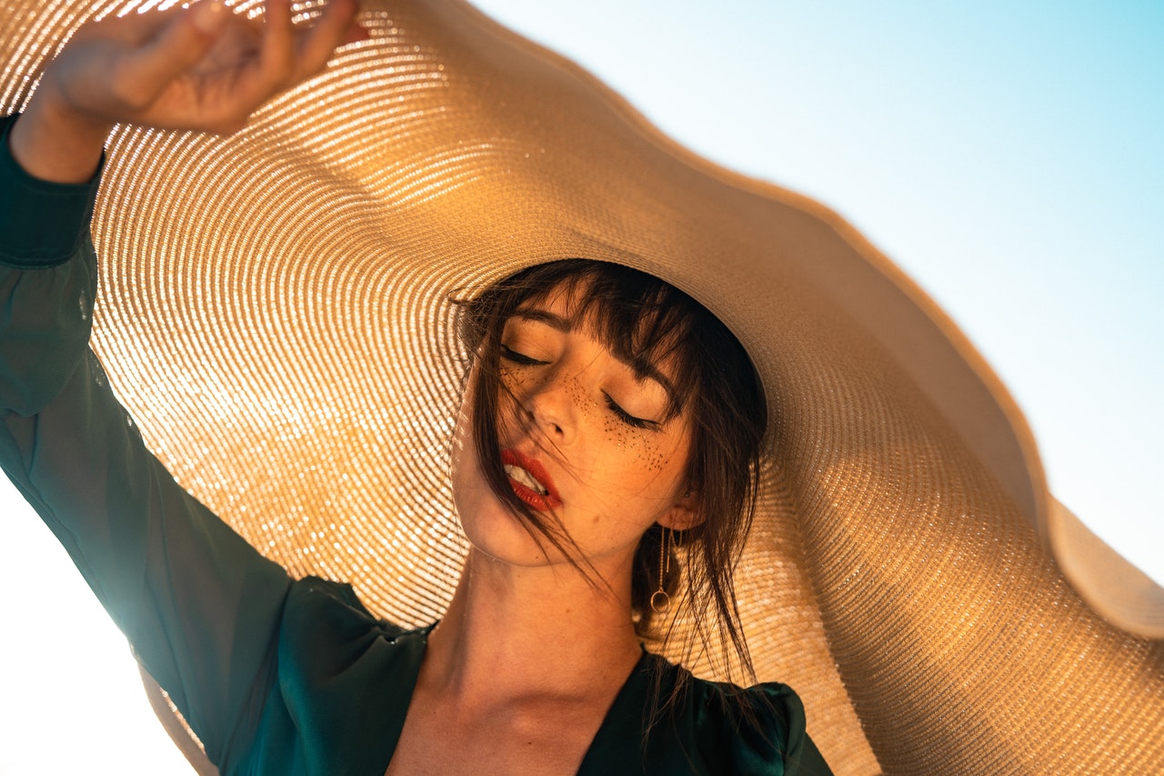 https://www.pexels.com/photo/woman-under-brown-hat-2906663/