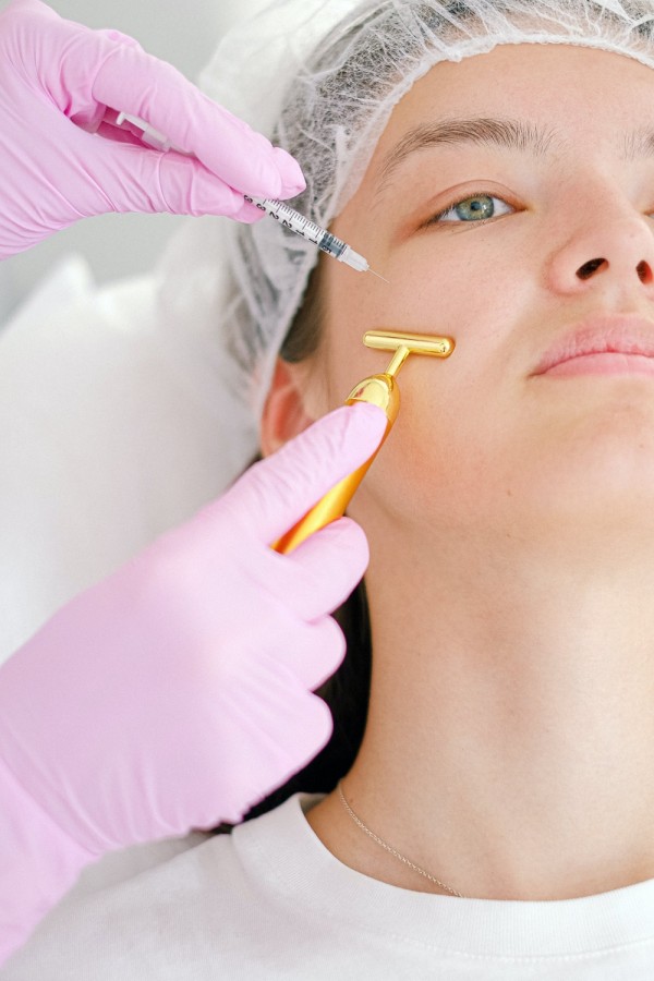A woman getting a facial treatment