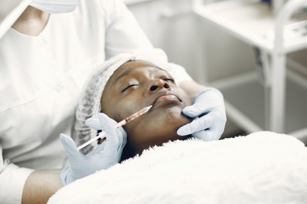 Woman getting lip injection