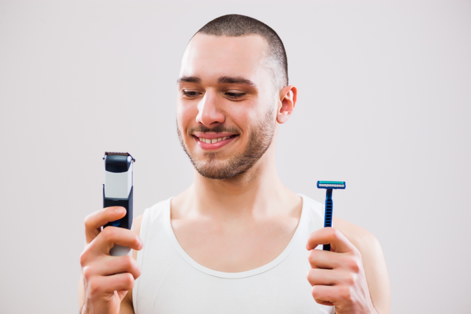 man grooming electric shaver vs manual razor