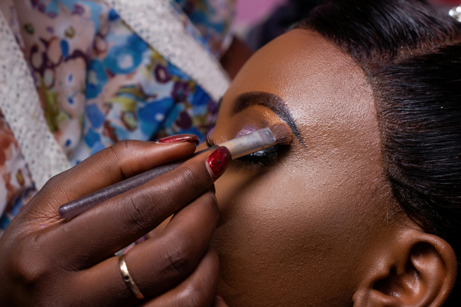 black woman getting makeup applied 