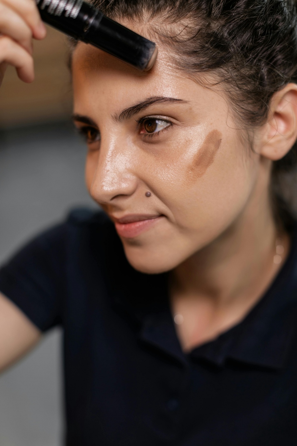 tan woman contouring face