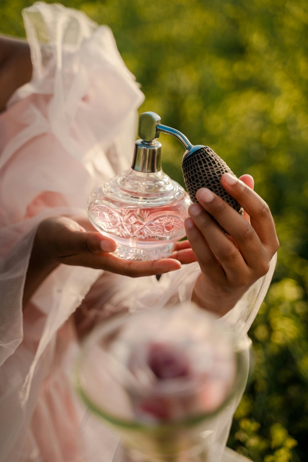 A woman applying perfume 