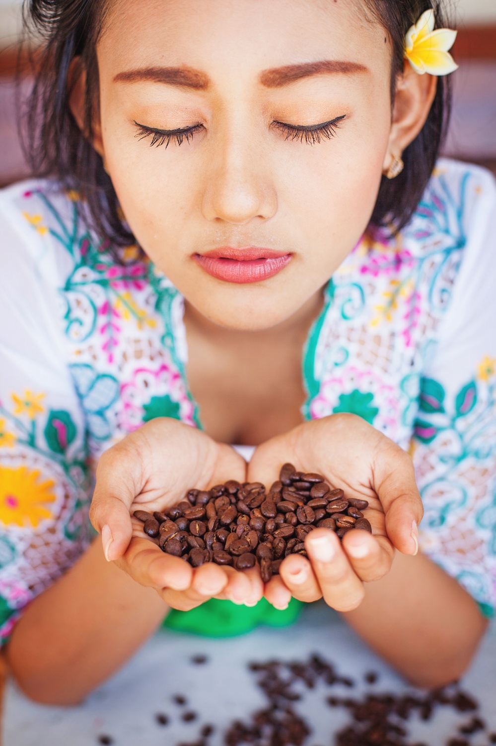 woman smelling coffee beans 