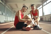 Girl helping guy with injury