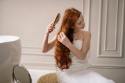 white red-head model brushing hair 