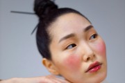 Asian woman wearing bold blush 