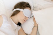 girl in white with sleep mask