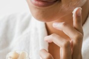 woman applying overnight mask or heavy moisturizer 