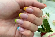 person with a colorful tip french manicure 